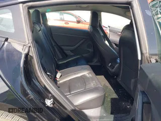 2022 Tesla Model 3 Long Range with VIN 5YJ3E1EB1NF133356, listed as a IAAI auction lot 41568303 with 73,406 mi miles and . Bid and sale history available at DreamBid. Image 8.