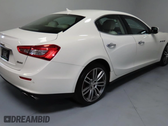 2014 Maserati Ghibli S Q4 z VIN ZAM57RTA7E1094580, wystawiony jako Copart lot #58866195 z przebiegiem 79 463 mil mil oraz Szkody całkowita. Historia ofert i sprzedaży dostępna na DreamBid. Obrazek 3.