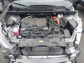 2022 Toyota RAV4 Hybrid SE z VIN 4T3T6RFV9NU070229, wystawiony jako IAAI lot #42565070 z przebiegiem 21 901 mil mil oraz . Historia ofert i sprzedaży dostępna na DreamBid. Obrazek 10.