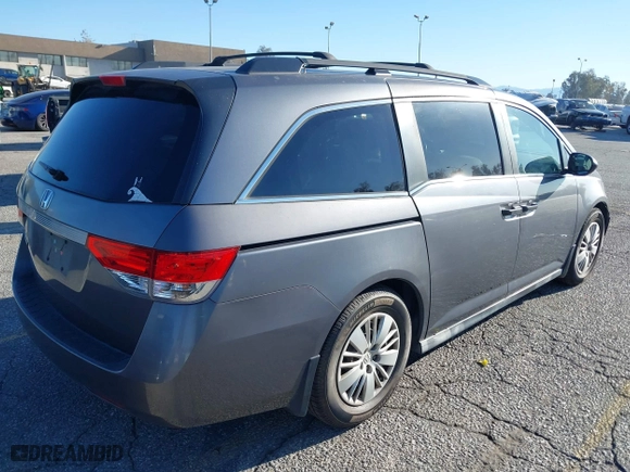 2014 Honda Odyssey LX with VIN 5FNRL5H23EB015067, listed as a IAAI auction lot 41760301 with 167,389 mi miles. Bid and sale history available at carsss.com. Image 4.