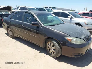 2002 Toyota Camry XLE z VIN 4T1BF30K02U500953, wystawiony jako IAAI lot #42084803 z przebiegiem Nie podano mil oraz . Historia ofert i sprzedaży dostępna na DreamBid. Obrazek 1.