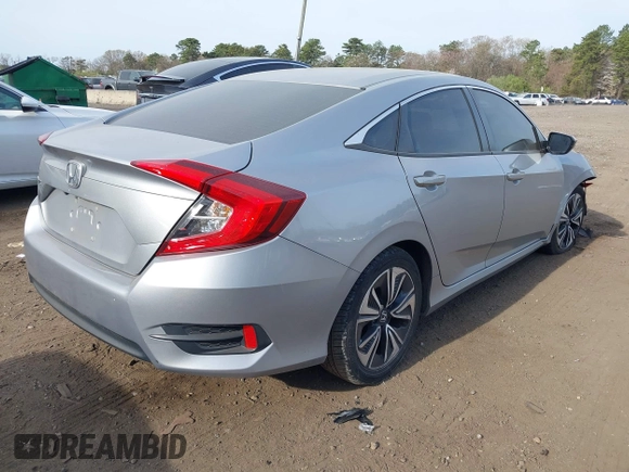 2018 Honda Civic Sedan LX with VIN 2HGFC2F5XJH573938, listed as a IAAI auction lot 42098109 with 69,037 mi miles. Bid and sale history available at carsss.com. Image 4.