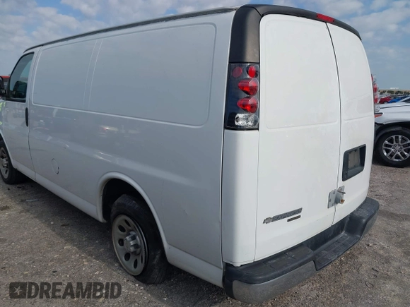 2014 Chevrolet Express Cargo Van with VIN 1GCSGAFX2E1121841, listed as a IAAI auction lot 42028712 with 164,768 mi miles. Bid and sale history available at carsss.com. Image 3.