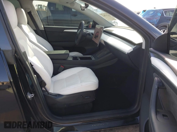 2022 Tesla Model Y Performance with VIN 7SAYGDEF6NF532027, listed as a IAAI auction lot 41717662 with 36,537 mi miles and . Bid and sale history available at DreamBid. Image 5.