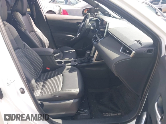 2024 Toyota Corolla Cross Hybrid S with VIN 7MUFBABG2RV024594, listed as a IAAI auction lot 42314362 with 9,031 mi miles and . Bid and sale history available at DreamBid. Image 5.
