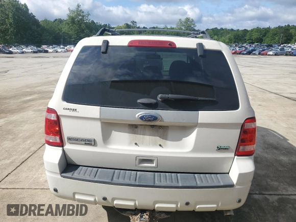 2011 Ford Escape Limited z VIN 1FMCU0EG2BKC70972, wystawiony jako Copart lot #58981605 z przebiegiem 120 117 mil mil oraz Szkoda całkowita • Salvage title. Historia ofert i sprzedaży dostępna na DreamBid. Obrazek 6.
