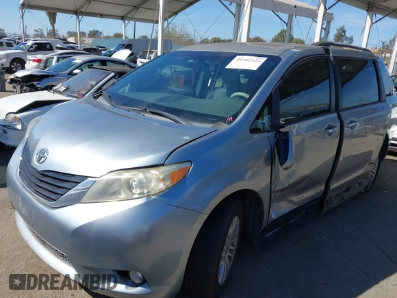 2011 Toyota Sienna XLE AAS with VIN 5TDYK3DC0BS107522, listed as a IAAI auction lot 41722324 with 171,855 mi miles and . Bid and sale history available at DreamBid. Image 2.