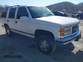 1999 GMC Yukon with VIN 1GKEK13R8XJ763098, listed as a IAAI auction lot 41753745 with 209,451 mi miles. Bid and sale history available at carsss.com. Image 1.