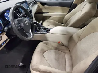 2022 Toyota Camry Hybrid LE with VIN 4T1C31AK4NU580374, listed as a IAAI auction lot 42088131 with 51,949 mi miles. Bid and sale history available at carsss.com. Image 1.