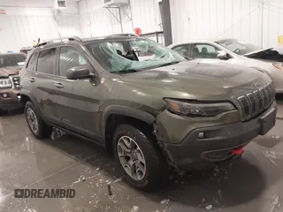 2020 Jeep Cherokee Trailhawk z VIN 1C4PJMBX4LD588401, wystawiony jako IAAI lot #41687657 z przebiegiem 69 755 mil mil oraz . Historia ofert i sprzedaży dostępna na DreamBid. Obrazek 1.