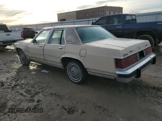 1987 Mercury Grand Marquis GS z VIN 2MEBM74F9HX714211, wystawiony jako Copart lot #43594205 z przebiegiem 26 933 mil mil oraz Szkody całkowita. Historia ofert i sprzedaży dostępna na DreamBid. Obrazek 2.