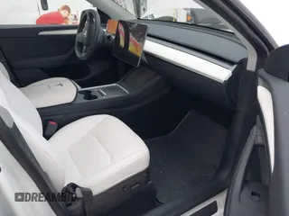2023 Tesla Model Y Long Range with VIN 7SAYGAEE8PF706706, listed as a IAAI auction lot 41297340 with 24,428 mi miles and . Bid and sale history available at DreamBid. Image 5.