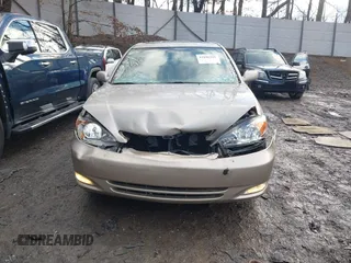 2003 Toyota Camry LE with VIN 4T1BE30K13U705105, listed as a IAAI auction lot 41696395 with 191,389 mi miles and . Bid and sale history available at DreamBid. Image 6.