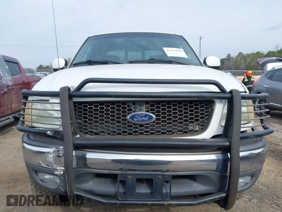 2003 Ford F-150 XLT with VIN 1FTRW08L73KA73945, listed as a IAAI auction lot 41474904 with 122,080 mi miles. Bid and sale history available at carsss.com. Image 13.