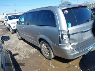 2016 Chrysler Town & Country Touring with VIN 2C4RC1BGXGR185642, listed as a IAAI auction lot 42092927 with 124,085 mi miles and . Bid and sale history available at DreamBid. Image 3.