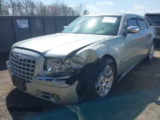 2006 Chrysler 300 C with VIN 2C3LA63H06H105774, listed as a IAAI auction lot 41918634 with 319,232 mi miles. Bid and sale history available at carsss.com. Image 6.