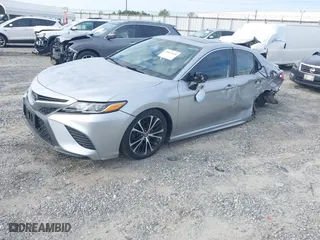 2020 Toyota Camry SE with VIN 4T1J11AKXLU879877, listed as a IAAI auction lot 40827028 with 176,872 mi miles. Bid and sale history available at carsss.com. Image 2.