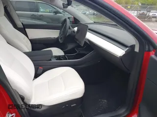 2021 Tesla Model Y Long Range with VIN 5YJYGDEE5MF085032, listed as a IAAI auction lot 41982925 with 64,541 mi miles and . Bid and sale history available at carsss.com. Image 5.