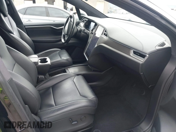 2017 Tesla Model X 90D with VIN 5YJXCAE2XHF075341, listed as a IAAI auction lot 41784008 with 77,439 mi miles and . Bid and sale history available at DreamBid. Image 5.