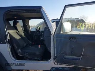 2006 Jeep Wrangler Sport Right Hand Drive with VIN 1J4F449SX6P764491, listed as a IAAI auction lot 41709726 with 290,798 mi miles. Bid and sale history available at carsss.com. Image 5.