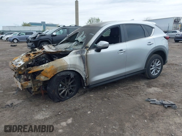 2023 Mazda CX-5 S Carbon Edition z VIN JM3KFBCMXP0265141, wystawiony jako IAAI lot #41946750 z przebiegiem Nie podano mil oraz . Historia ofert i sprzedaży dostępna na DreamBid. Obrazek 2.