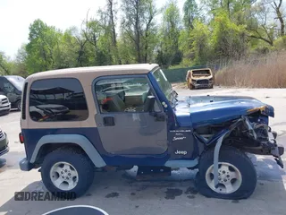 2000 Jeep Wrangler Sport with VIN 1J4FA49S5YP750123, listed as a IAAI auction lot 42060009 with Not Provided miles. Bid and sale history available at carsss.com. Image 13.