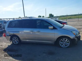 2005 Honda Odyssey EX z VIN 5FNRL38465B411189, wystawiony jako IAAI lot #42310199 z przebiegiem 304 142 mil mil oraz . Historia ofert i sprzedaży dostępna na DreamBid. Obrazek 13.