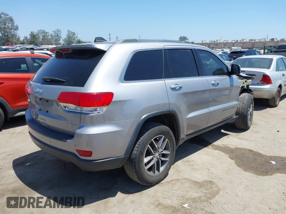 2018 Jeep Grand Cherokee Laredo E with VIN 1C4RJEAG2JC429850, listed as a IAAI auction lot 42541574 with 72,009 mi miles and . Bid and sale history available at DreamBid. Image 4.