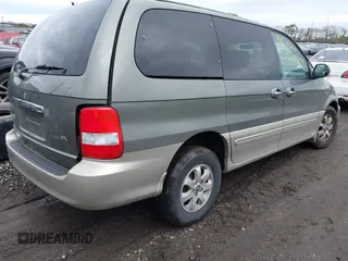 2005 Kia Sedona LX with VIN KNDUP132756687577, listed as a IAAI auction lot 41970855 with Not Provided miles and . Bid and sale history available at DreamBid. Image 4.