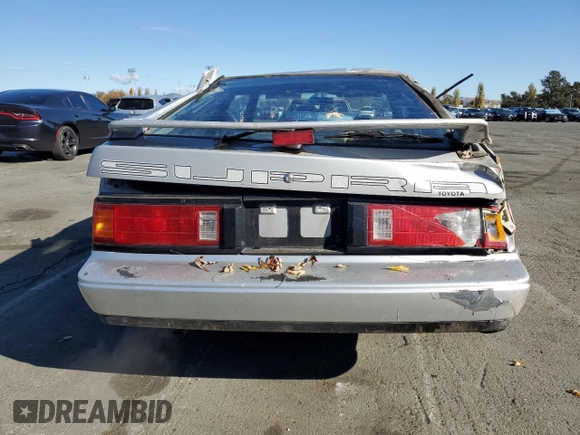 1986 Toyota Supra z VIN JT2MA67L9G0175108, wystawiony jako Copart lot #80793984 z przebiegiem 158 959 mil mil oraz Szkoda całkowita • Salvage title. Historia ofert i sprzedaży dostępna na DreamBid. Obrazek 6.