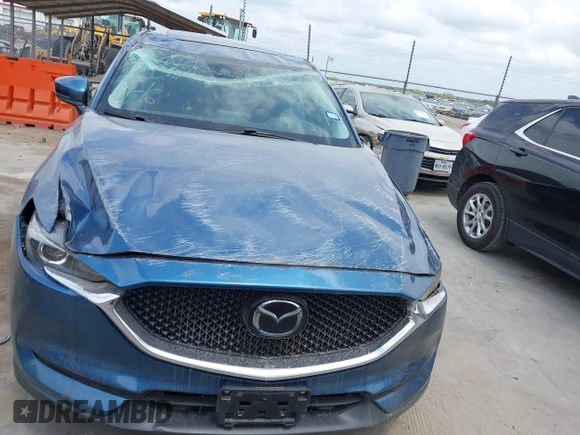 2018 Mazda CX-5 Touring z VIN JM3KFACM5J1442416, wystawiony jako IAAI lot #42093137 z przebiegiem 65 102 mil mil oraz . Historia ofert i sprzedaży dostępna na DreamBid. Obrazek 13.