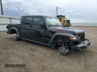 2023 Jeep Gladiator Rubicon with VIN 1C6JJTBG7PL573197, listed as a Copart auction lot 53866075 with 19,521 mi miles and Salvage title. Bid and sale history available at DreamBid. Image 4.