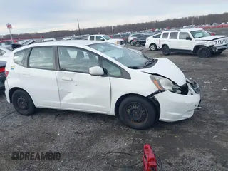 2013 Honda Fit with VIN JHMGE8H39DC005052, listed as a IAAI auction lot 41008236 with 124,874 mi miles. Bid and sale history available at carsss.com. Image 13.