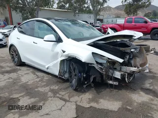 2023 Tesla Model Y Performance z VIN 7SAYGDEFXPF809250, wystawiony jako IAAI lot #42107371 z przebiegiem 28 867 mil mil oraz . Historia ofert i sprzedaży dostępna na DreamBid. Obrazek 1.
