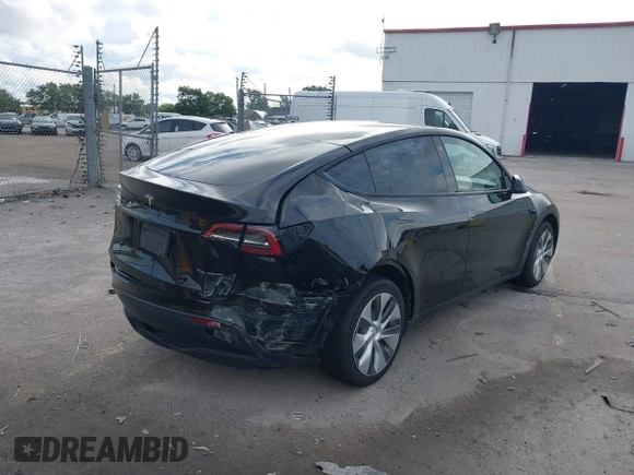 2023 Tesla Model Y Long Range with VIN 7SAYGDEE2PA044328, listed as a IAAI auction lot 42427625 with 41,324 mi miles and . Bid and sale history available at DreamBid. Image 4.