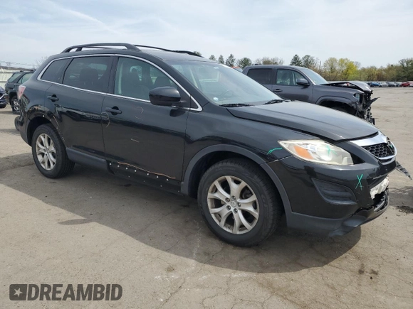 2011 Mazda CX-9 Sport with VIN JM3TB3BVXB0320390, listed as a Copart auction lot 53681995 with 125,829 mi miles and Salvage Title. Bid and sale history available at DreamBid. Image 4.