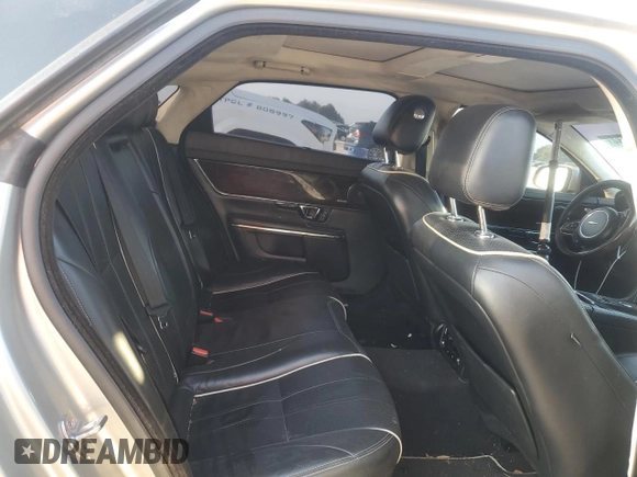 2014 Jaguar XJ Portfolio with VIN SAJWJ2GD7E8V61558, listed as a Copart auction lot 66850034 with 130,984 mi miles and Salvage title. Bid and sale history available at DreamBid. Image 11.