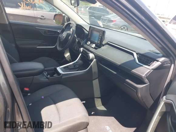 2019 Toyota RAV4 LE with VIN JTMG1RFV9KD014526, listed as a IAAI auction lot 42638858 with 90,995 mi miles and . Bid and sale history available at DreamBid. Image 5.