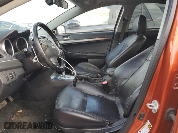 2011 Mitsubishi Lancer GTS with VIN JA32U8FW6BU011215, listed as a Copart auction lot 86357004 with 128,577 mi miles and Salvage Title. Bid and sale history available at carsss.com. Image 7.