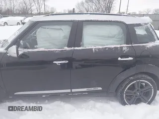 2016 MINI Countryman S with VIN WMWZC3C56GWT11105, listed as a IAAI auction lot 41228246 with 102,971 mi miles and . Bid and sale history available at DreamBid. Image 14.