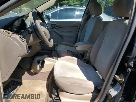 2004 Ford Focus ZTW with VIN 1FAFP35Z84W203676, listed as a Copart auction lot 57272835 with 183,115 mi miles and Salvage title. Bid and sale history available at DreamBid. Image 7.