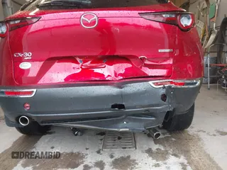 2023 Mazda CX-30 S Premium with VIN 3MVDMBDM5PM518612, listed as a IAAI auction lot 42219265 with 29,135 mi miles and . Bid and sale history available at DreamBid. Image 6.