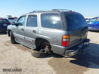 2002 Chevrolet Tahoe LT with VIN 1GNEC13Z12J233208, listed as a IAAI auction lot 41659873 with 238,922 mi miles. Bid and sale history available at carsss.com. Image 3.