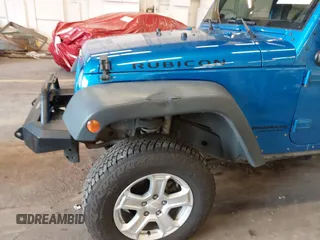 2015 Jeep Wrangler Unlimited Rubicon with VIN 1C4BJWFG7FL661643, listed as a IAAI auction lot 41291385 with 112,785 mi miles. Bid and sale history available at carsss.com. Image 6.