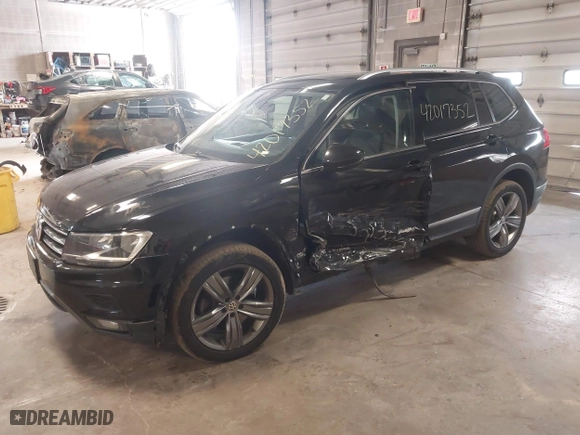 2020 Volkswagen Tiguan SE with VIN 3VV2B7AX4LM115131, listed as a IAAI auction lot 42017352 with 87,909 mi miles. Bid and sale history available at carsss.com. Image 2.