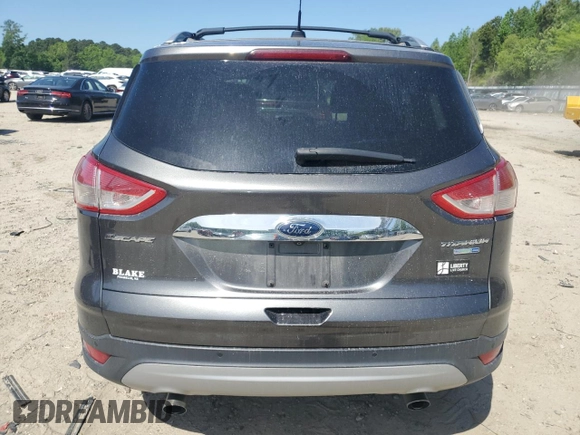2015 Ford Escape Titanium with VIN 1FMCU9J92FUC74879, listed as a Copart auction lot 54683185 with 143,436 mi miles and Salvage title. Bid and sale history available at DreamBid. Image 6.