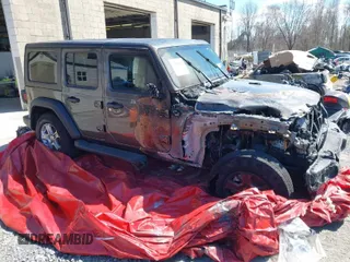 2021 Jeep Wrangler Unlimited 80th Anniversary z VIN 1C4HJXDG9MW585597, wystawiony jako IAAI lot #31200019 z przebiegiem 12 822 mil mil oraz . Historia ofert i sprzedaży dostępna na DreamBid. Obrazek 1.