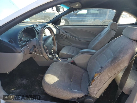 1997 Ford Mustang with VIN 1FALP4043VF174092, listed as a Copart auction lot 86983884 with 105,774 mi miles and Salvage Title. Bid and sale history available at carsss.com. Image 7.