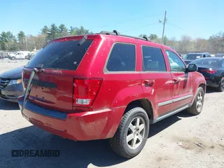 2009 Jeep Grand Cherokee Laredo with VIN 1J8GR48K79C543304, listed as a IAAI auction lot 42151011 with 157,679 mi miles. Bid and sale history available at carsss.com. Image 4.