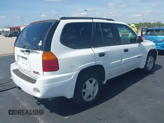 2003 GMC Envoy SLT z VIN 1GKDS13S532221928, wystawiony jako IAAI lot #42211340 z przebiegiem 149 902 mil mil oraz . Historia ofert i sprzedaży dostępna na DreamBid. Obrazek 4.